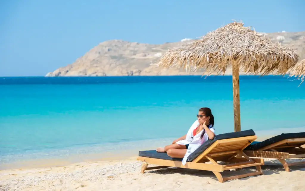 A woman on a sunbed in a Mykonos beach